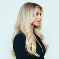 Side view of 16 inch Divine Pearl Blonde clip in hair extensions featuring silky texture and dimensional blonde color