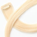 Close up of Divine Pearl Blonde clip in hair extensions clip designed for secure hold and easy application