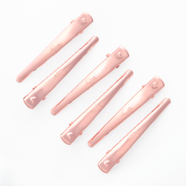 Divine Duckbill Clips holding hair extensions during styling