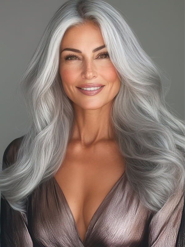 Woman showcasing 16
-inch Icy Salt &Pepper clip-in hair extensions from Seventh Heaven. Silky, cool-toned blend with premium full cuticle hair for an elegant, icy look.