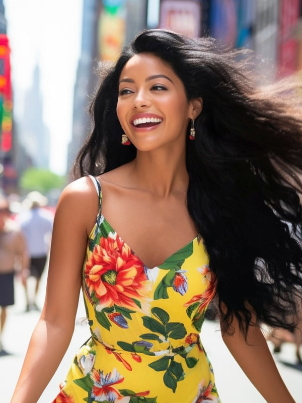 Model wearing Midnight Mystique Black clip-in hair extensions from Seventh Heaven, showcasing voluminous, flowing black hair in a vibrant city scene.