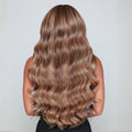 Back view of 20 inch rooted dark sandy bronde clip-in hair extensions showing length and blend