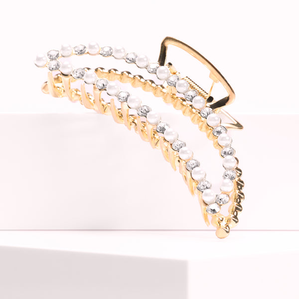 The Opal Celestial Claw Clip by Seventh Heaven. Features a shimmering opal-inspired design for a chic and secure styling solution.