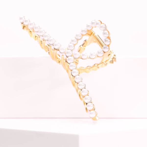 The Pearl Celestial Claw Clip from Seventh Heaven. A luxurious hair accessory designed for a timeless and secure hold with a pearl-like finish.