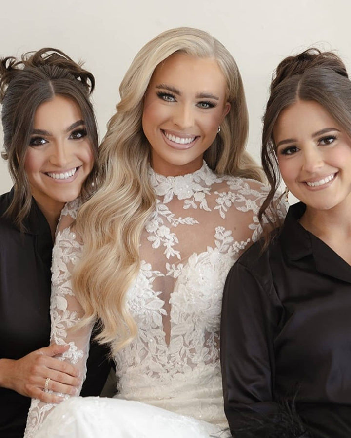 Ainsley Howell in her wedding dress wearing soft glam waves with Seventh Heaven bridal clip-in hair extensions outdoors in natural light