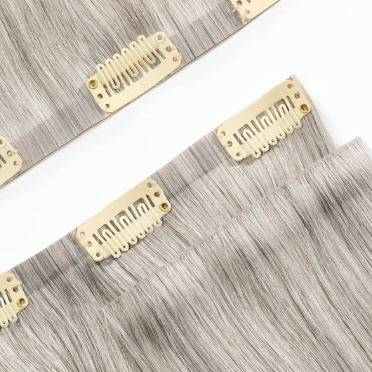 Close-up of reinforced band on icy salt and pepper clip-in hair extensions