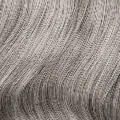 Close-up swatch of Sacred Salt & Pepper clip-in hair extensions showing silver and charcoal color blend