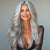 Model wearing Salt and Pepper full cuticle clip-in hair extensions for natural gray hair look