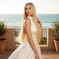 20 inch Celestial Beach Blonde clip in hair extensions worn in outdoor lifestyle setting with flowing length