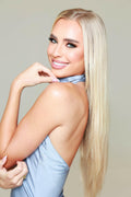 Side profile of Celestial Beach Blonde 20-inch clip-in hair extensions from Seventh Heaven. Full cuticle, luxurious extensions with a natural beachy blonde color.