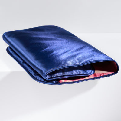 Open Trusty Tri-Fold Hair Extension Organizer displaying compartments for secure hair extension storage.