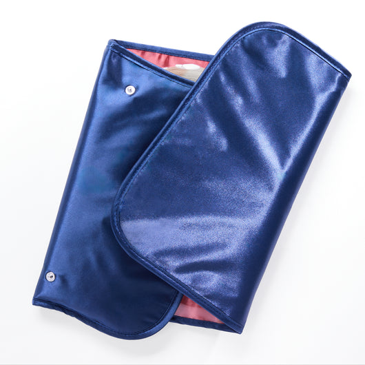 Trusty Tri-Fold Hair Extension Organizer placed on a vanity, ideal for stylish and organized hair extension storage.