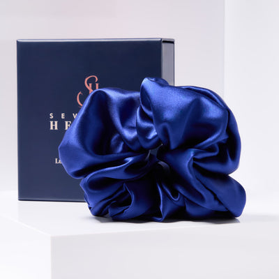 Royal blue mulberry silk scrunchie displayed with Seventh Heaven luxury gift box