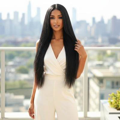 Lifestyle photo of 20 inch Midnight Mystique black clip in hair extensions worn sleek and long for an elegant look