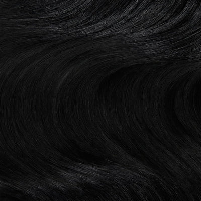 Close up swatch of Midnight Mystique black clip in hair extensions showing rich jet black color and silky texture