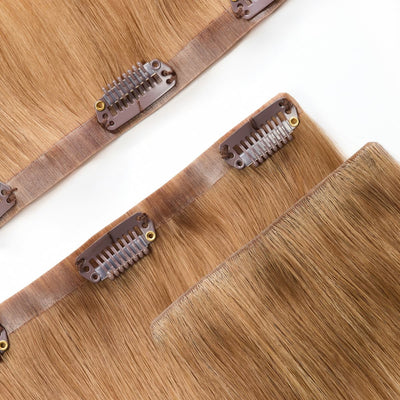 Close-up of Rooted Creamy Beach Blonde clip-in hair extension band with reinforced stitching and premium weft