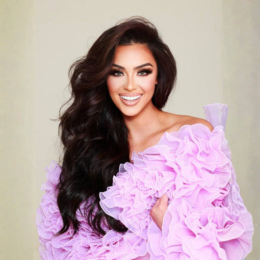 20 inch Sophisticated Natural Black clip in hair extensions showing full volume and smooth, natural movement