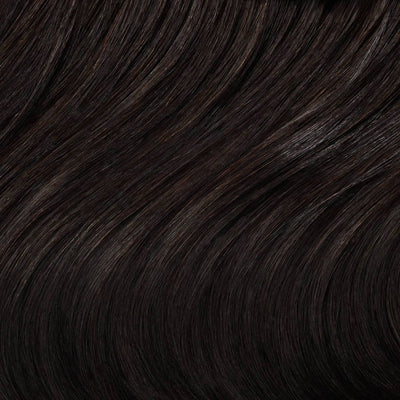 Close-up swatch of Sophisticated Natural Black clip in hair extensions showing rich tone and silky texture